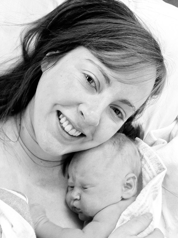 Mother holding newborn baby for the first time | Charlotte Geary